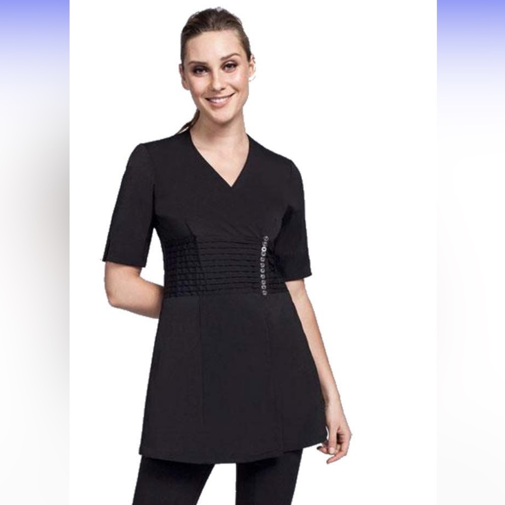 Noel Asmar Black aesthetician / RMT uniform.
